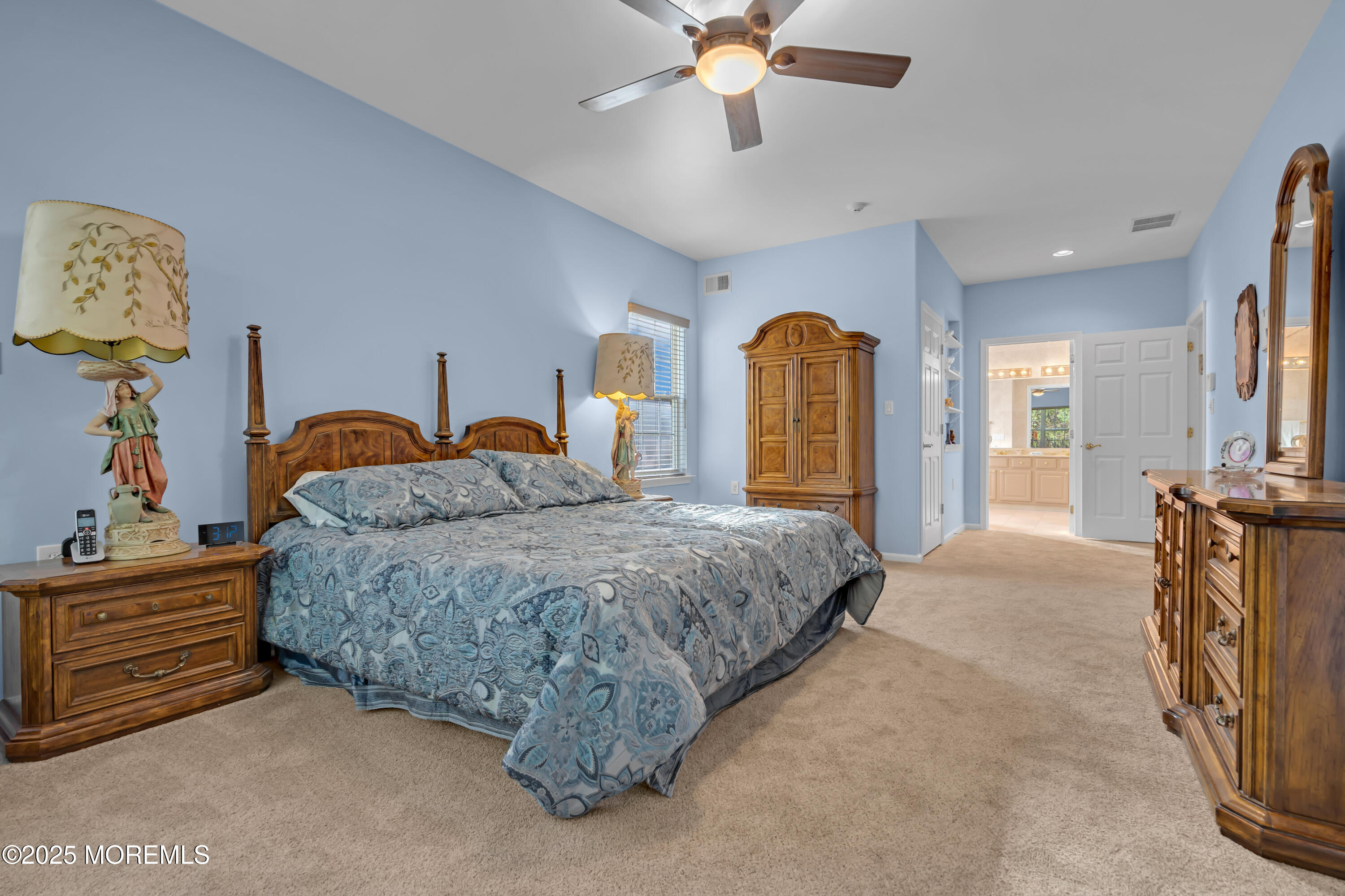 60 Eleanor Road Manchester Township, NJ 08759 - Photo 41 of 45 a spacious bedroom with a bed and a chandelier