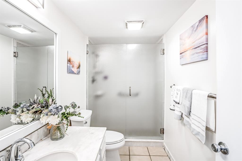 5100 North Ocean Boulevard, Unit 1217 Lauderdale-by-the-Sea, FL 33308 - Photo 11 of 32 a bath room with a toilet and a shower