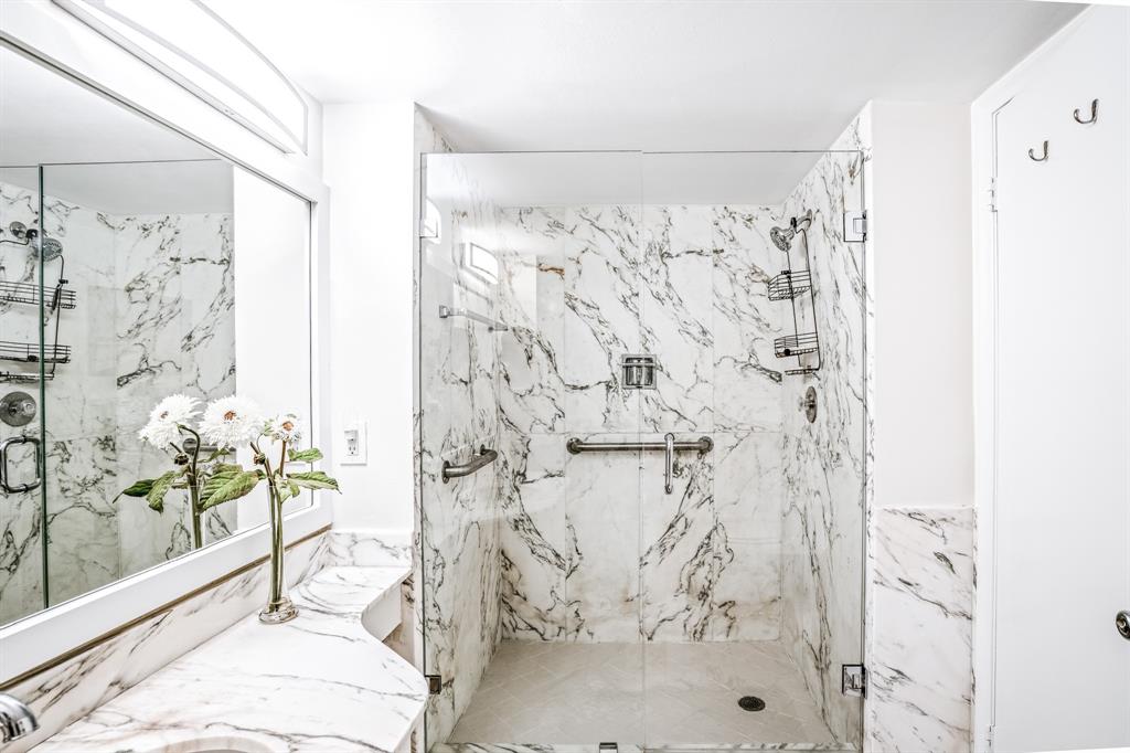 5100 North Ocean Boulevard, Unit 1217 Lauderdale-by-the-Sea, FL 33308 - Photo 15 of 32 a bathroom with a shower curtain