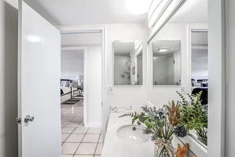 a bathroom with a sink and mirror