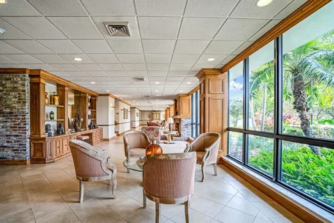 a view of a dining room with furniture water view and mountain view