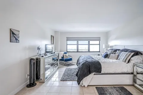 a bed room with a bed and a couch