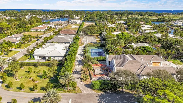 an aerial view of residential houses with outdoor space