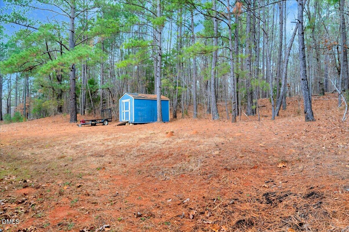 1779 Wise-Five Forks Road Macon, NC 27551 - Photo 22 of 23 a view of backyard with trees