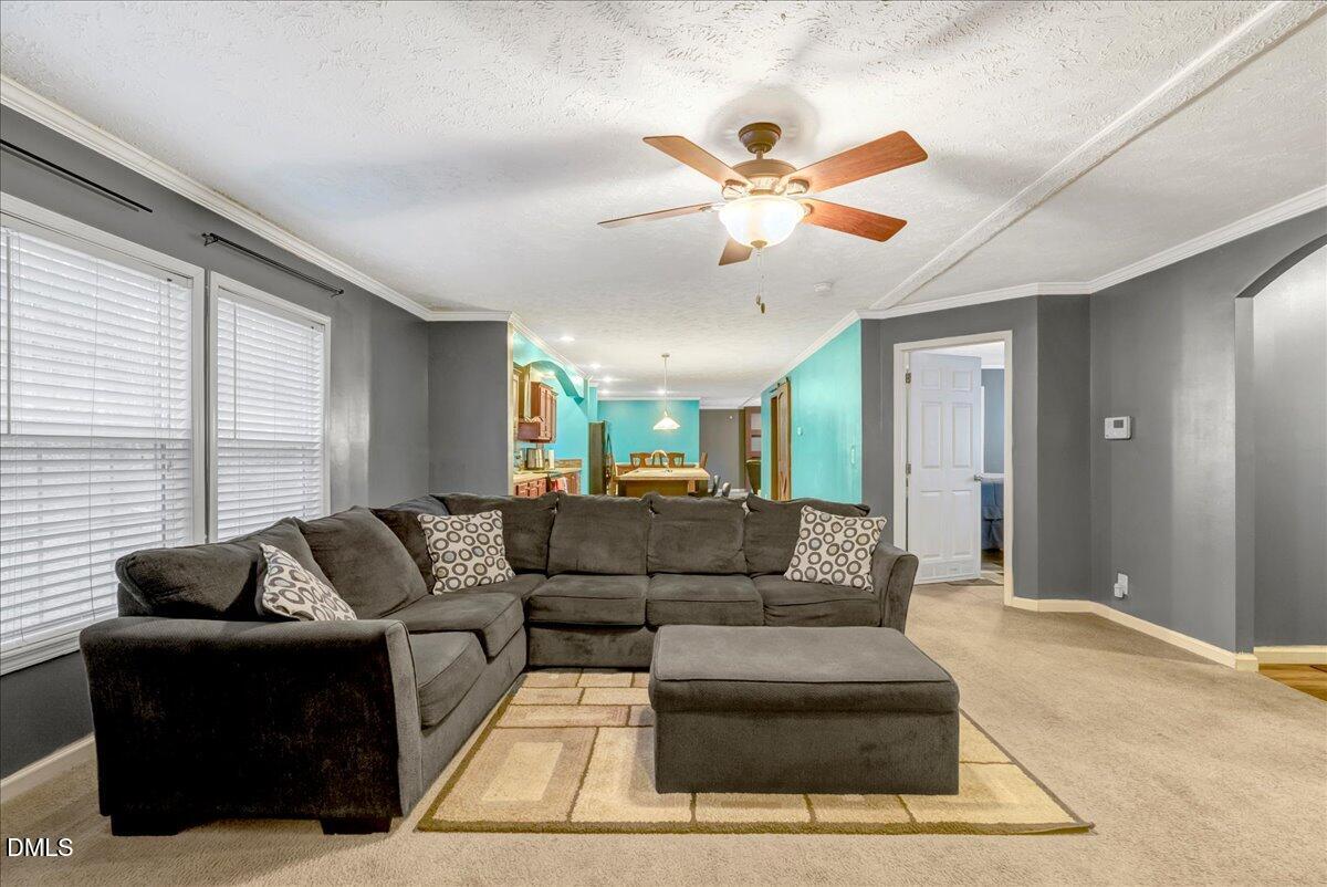 1779 Wise-Five Forks Road Macon, NC 27551 - Photo 3 of 23 a living room with furniture and a large window