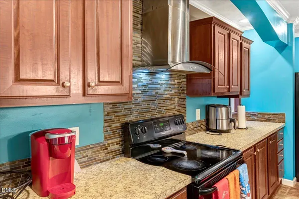 a kitchen with a stove and a sink