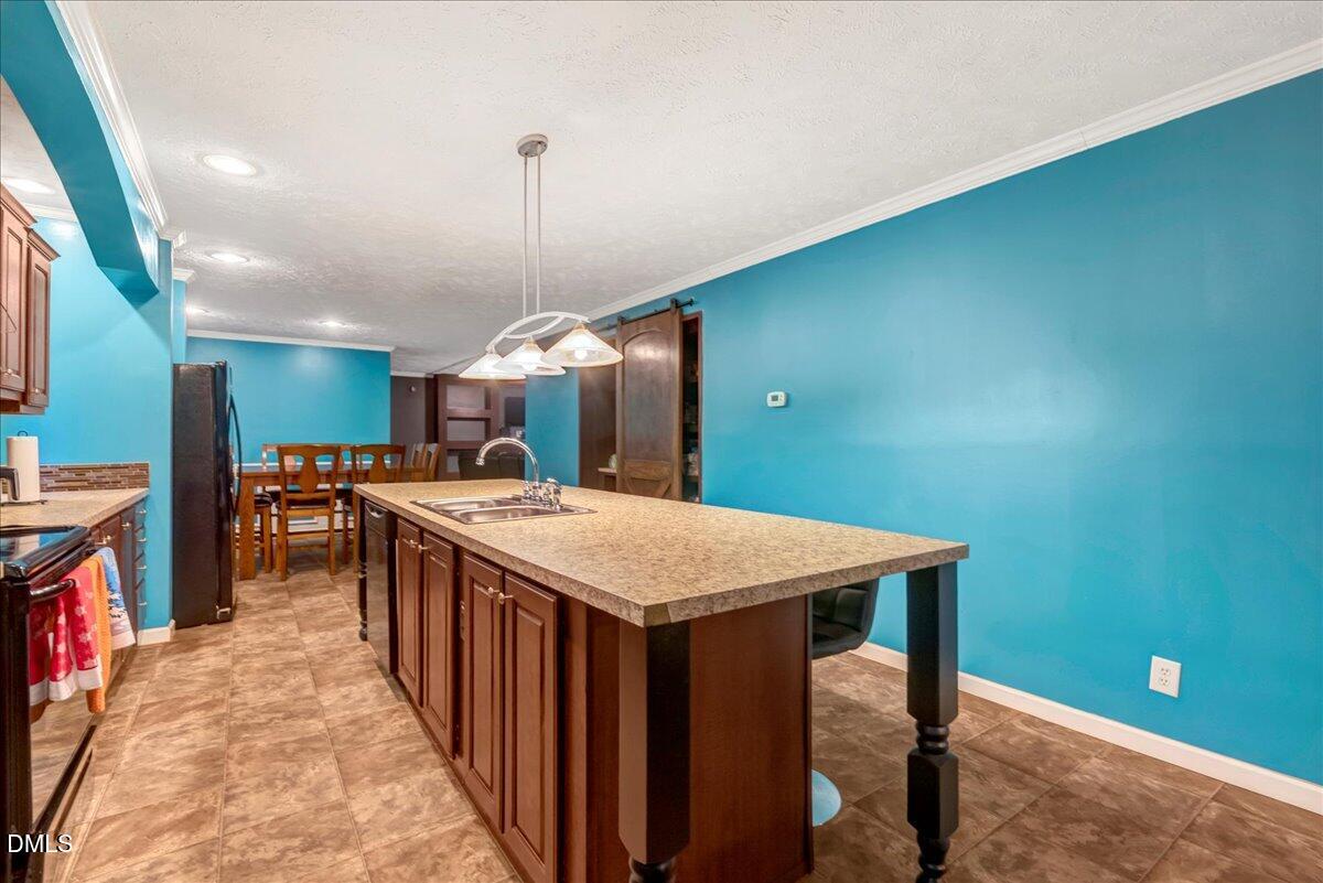 1779 Wise-Five Forks Road Macon, NC 27551 - Photo 7 of 23 a large kitchen with a table and chairs