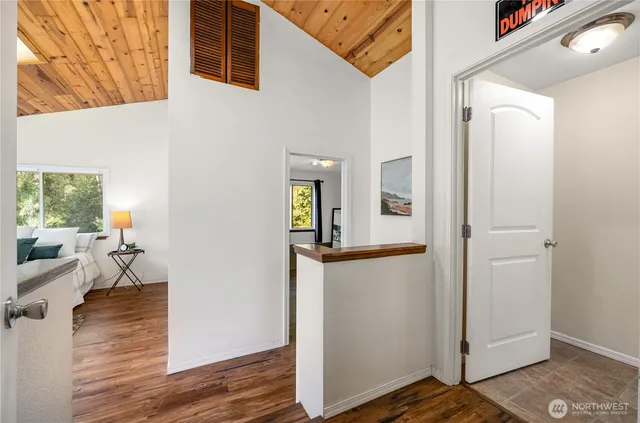 hallway with wooden floor and furniture
