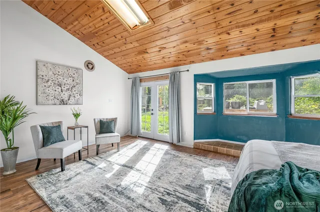 a bedroom with furniture and a window