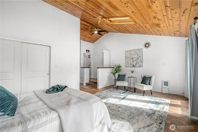 a bedroom with a bed and a table in it