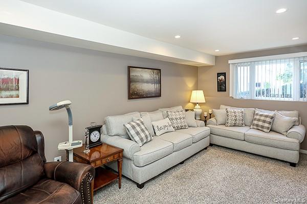 1102 Lawrence Road Bellmore, NY 11710 - Photo 25 of 33 Recessed ceiling lighting, neutral wall tones, carpeted flooring, and window treatments