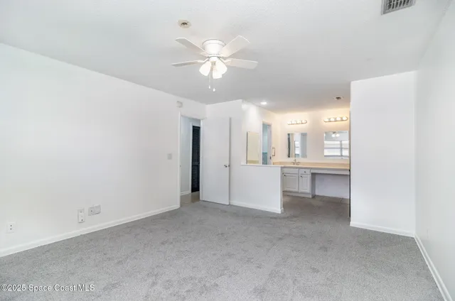 a view of a kitchen with a sink and a window