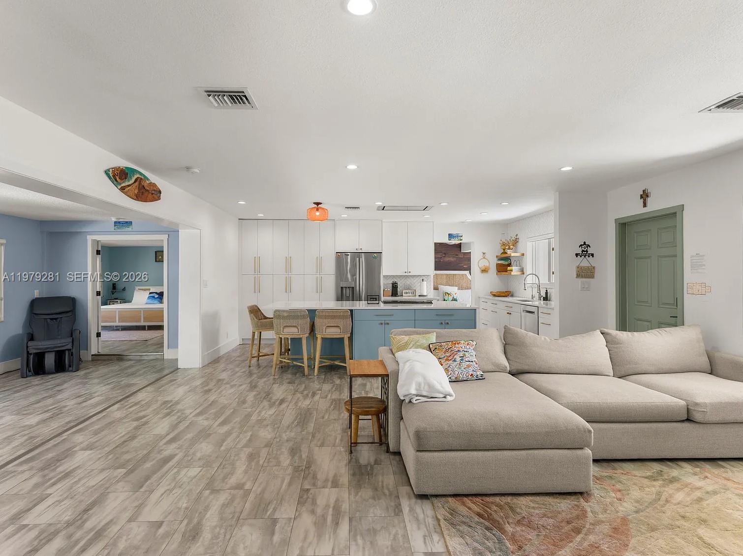 2211 Northeast 35th Court Lighthouse Point, FL 33064 - Photo 14 of 21 a living room with furniture and kitchen view