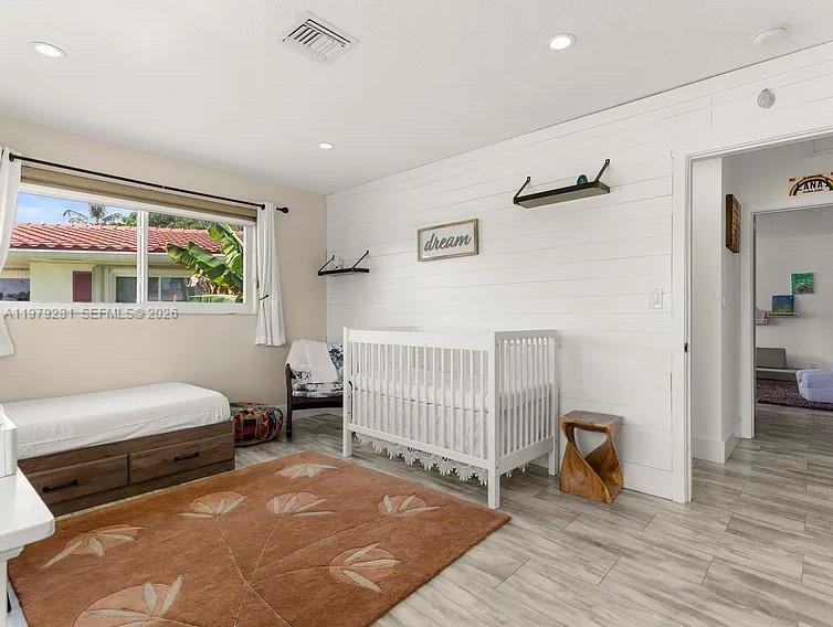 2211 Northeast 35th Court Lighthouse Point, FL 33064 - Photo 21 of 21 a bedroom with furniture and a window