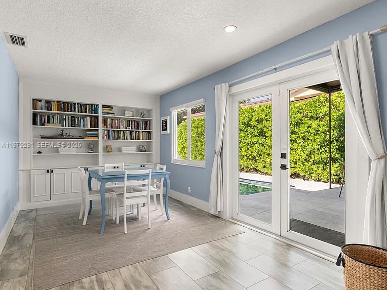 2211 Northeast 35th Court Lighthouse Point, FL 33064 - Photo 9 of 21 a dining room with furniture and a window