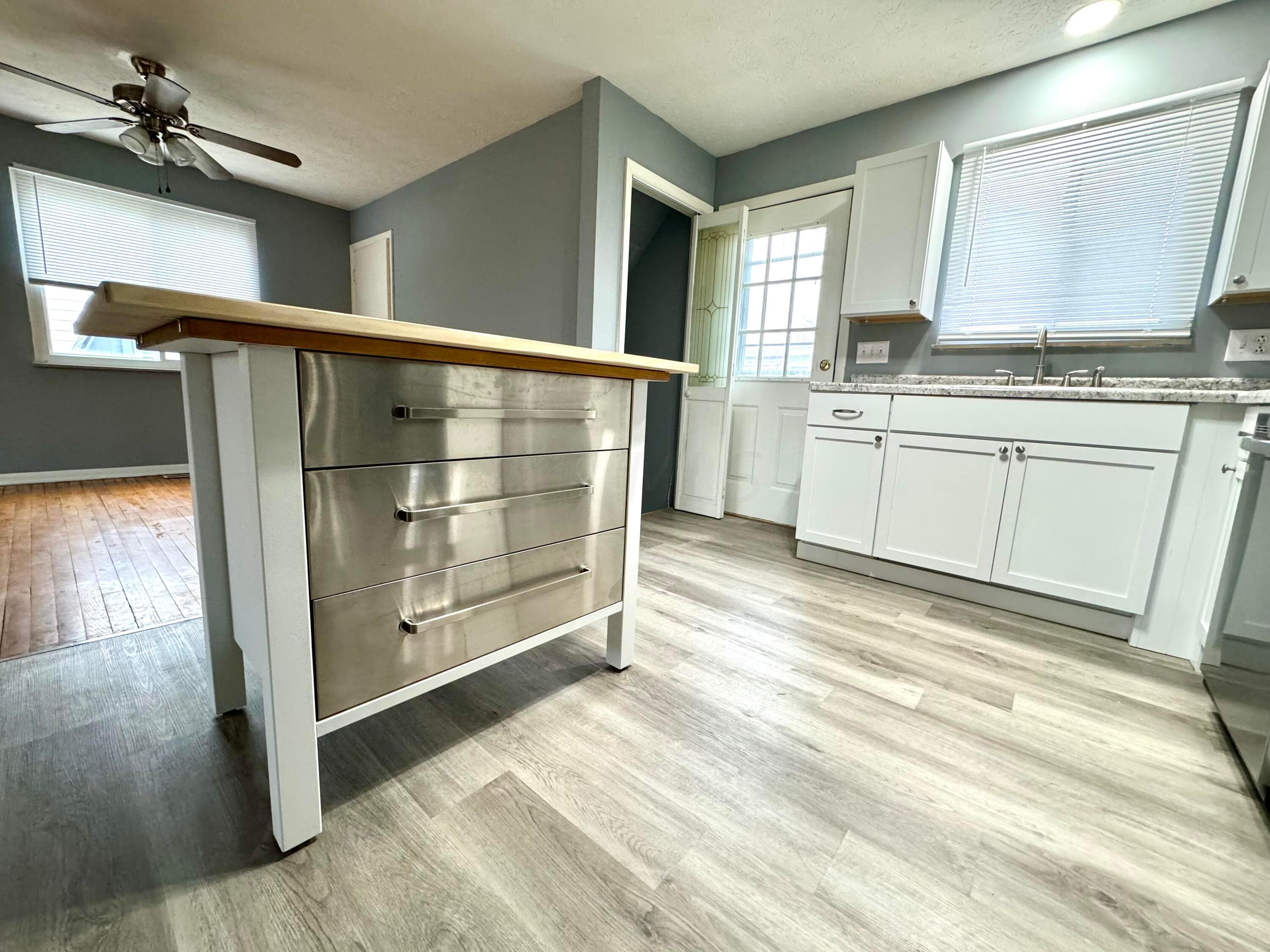 609 Raleigh Drive Columbus, OH 43228 - Photo 10 of 33 Island, Offer storage and bar seating.