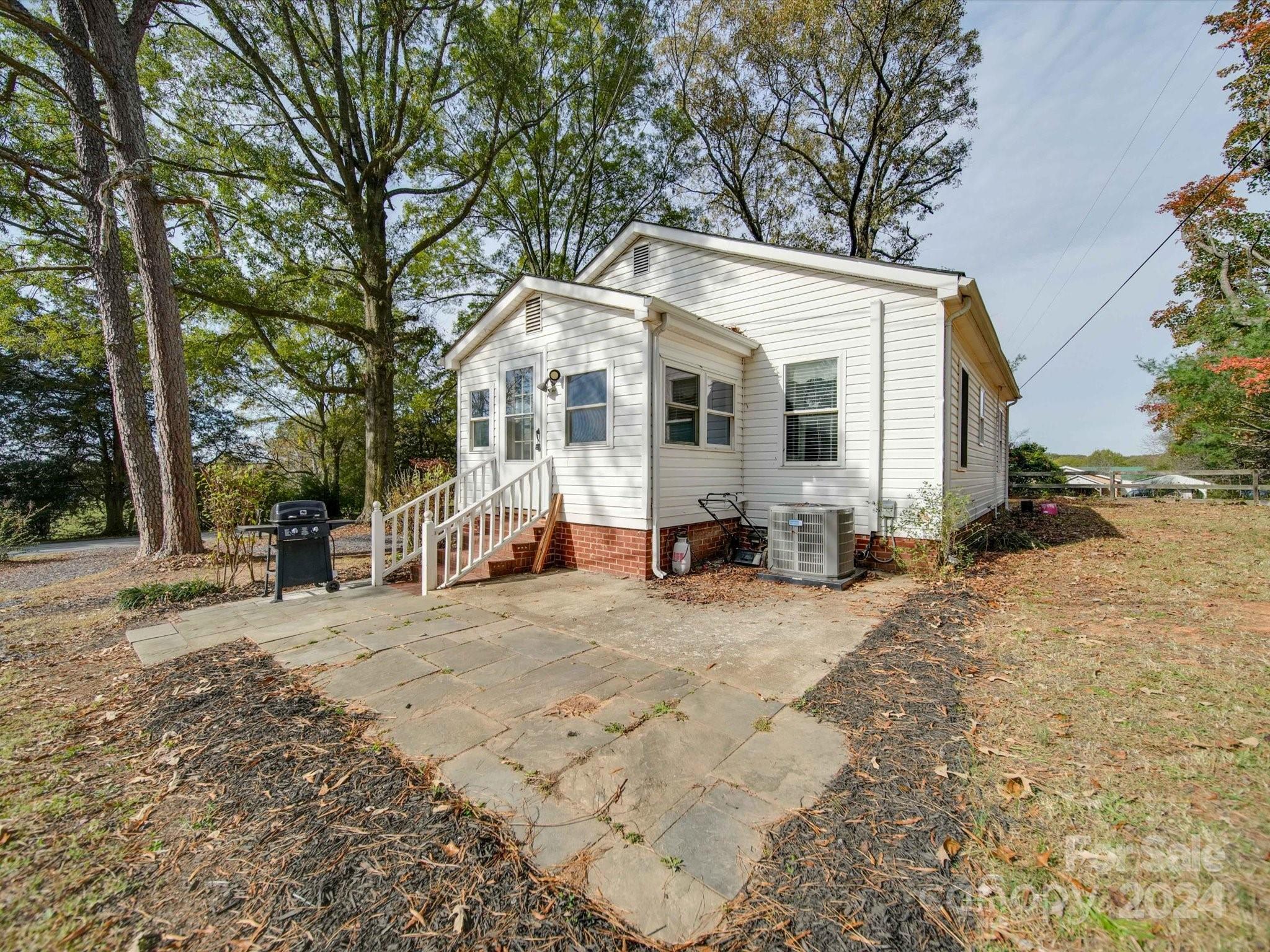 6362 Talley Road Stanfield, NC 28163 - Photo 35 of 39 a view of a house with a yard covered in snow