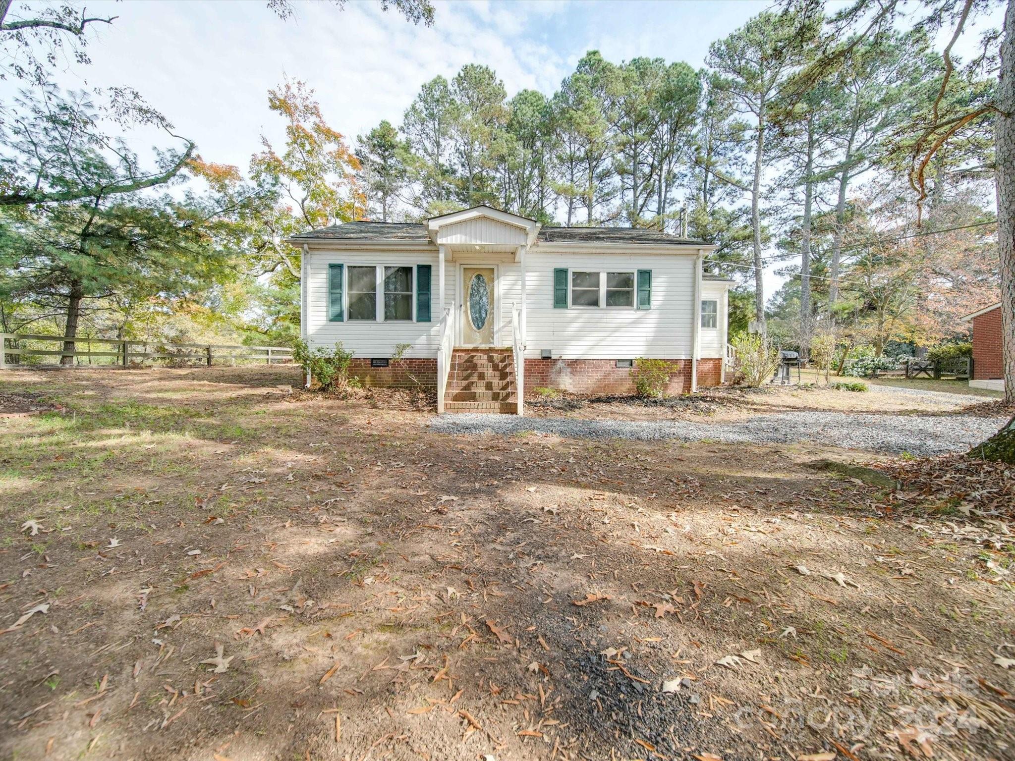 6362 Talley Road Stanfield, NC 28163 - Photo 39 of 39 a backyard of a house with yard and outdoor seating