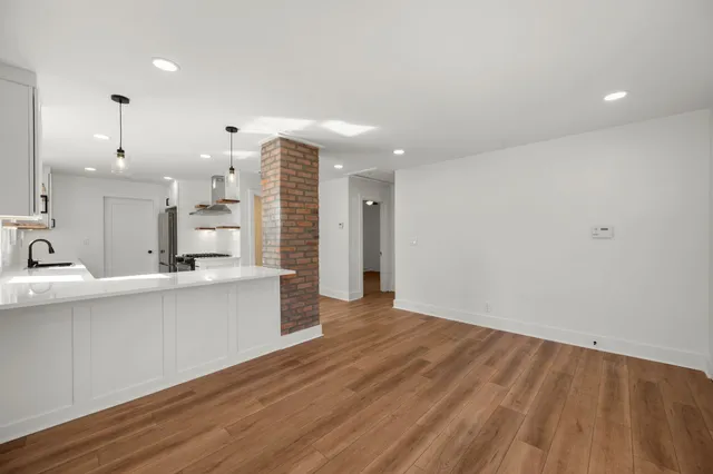 a view of kitchen with wooden floor
