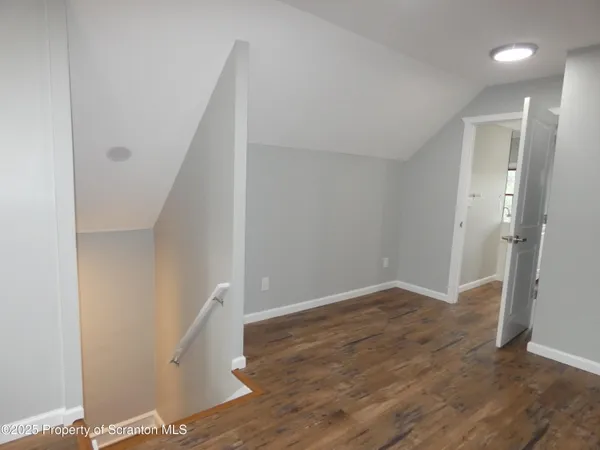 an entryway of a house with windows