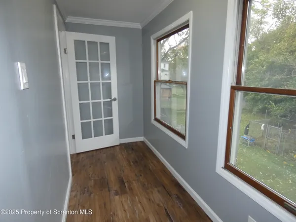 a view of a storage room with water heater and racks