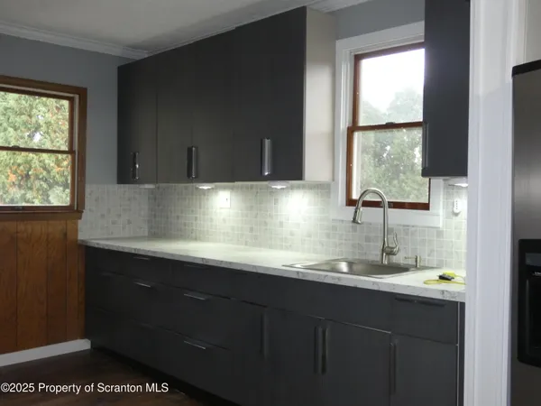 a kitchen with a stove and a microwave