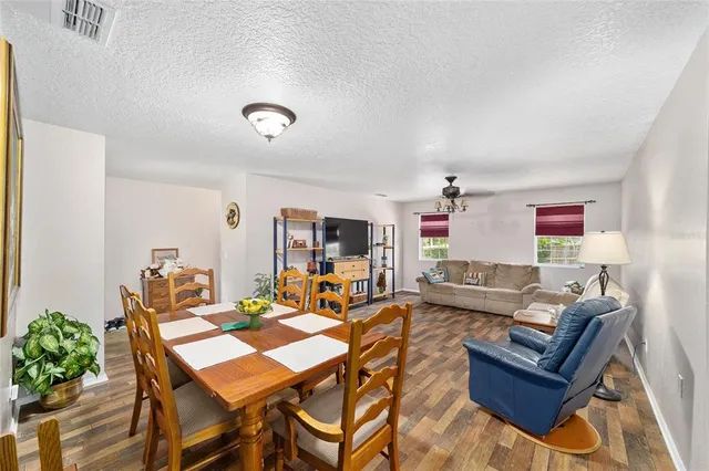 a dining room with furniture and window