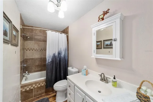 a bedroom with a bed and a lamp