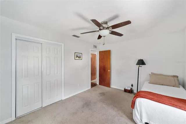 a bed room with a bed and a window