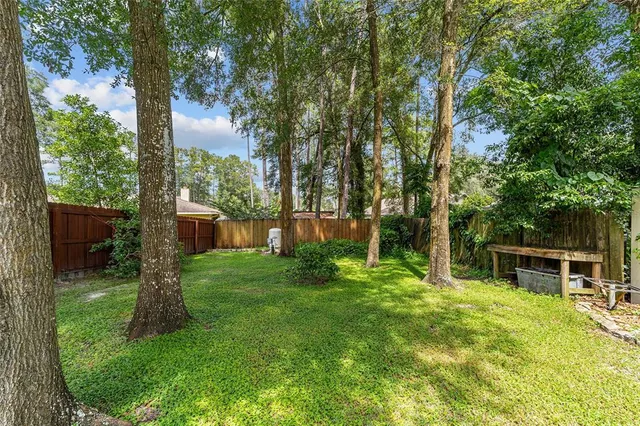 a view of a chair and table in the garden