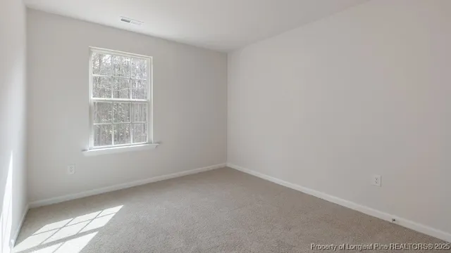 a bathroom with a double vanity sink mirror and shower