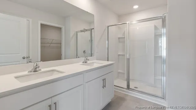 a bathroom with a granite countertop toilet sink and a bathtub