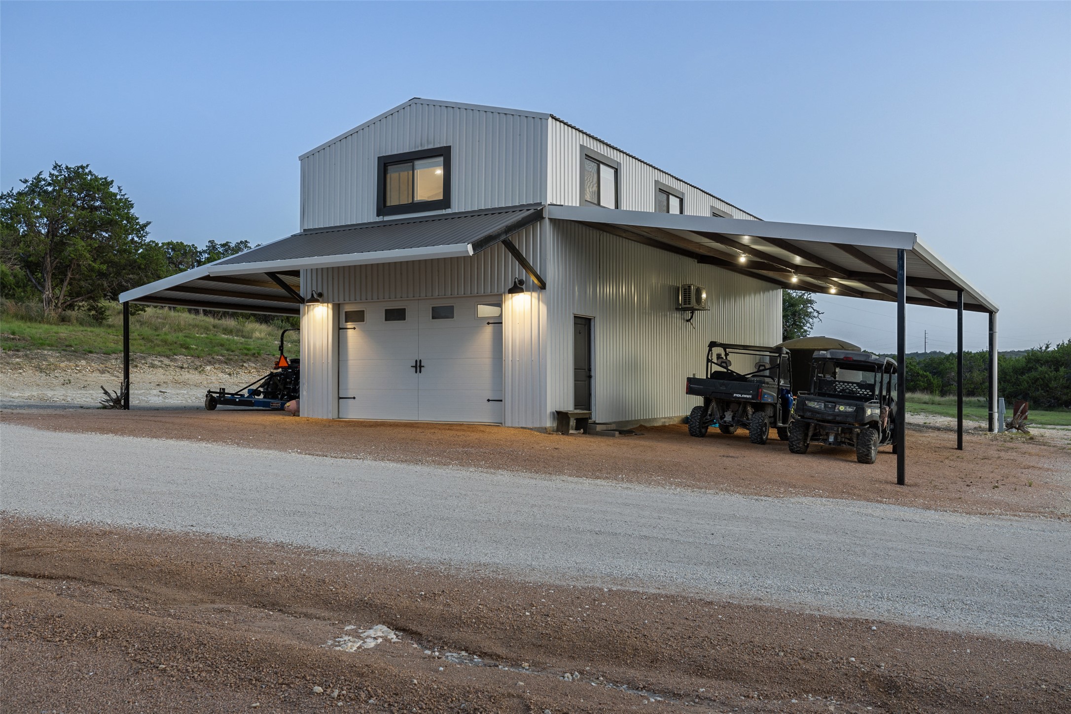 830 Ulrich Road Johnson City, TX 78636 - Photo 13 of 40 A striking modern barn structure with ample covered parking for all your recreational vehicles.