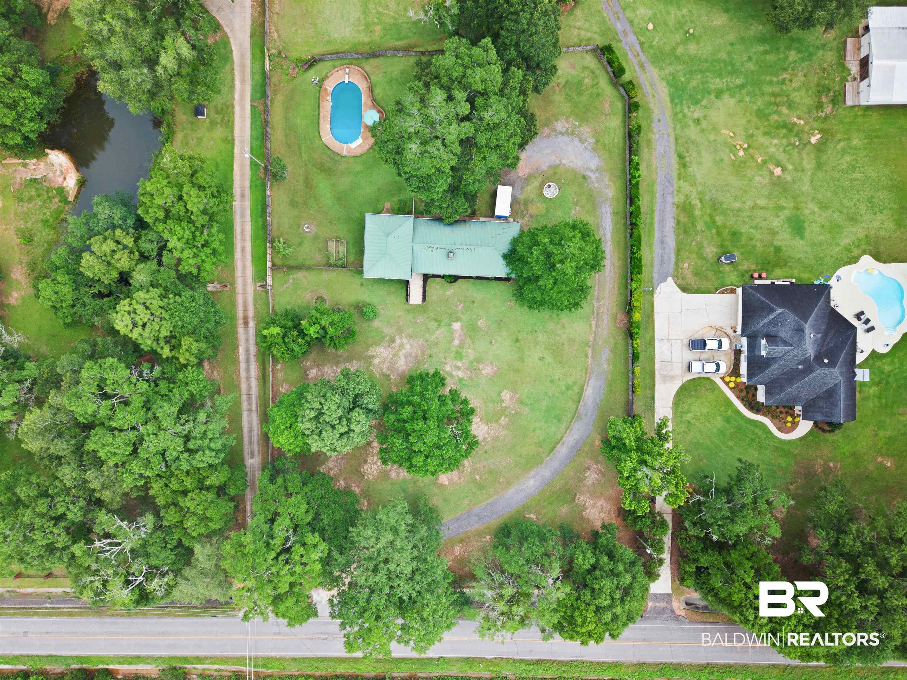 10420 Johnson Road South Mobile, AL 36695 - Photo 75 of 75 Expansive property featuring a circular driveway, mature trees, and a private pond
