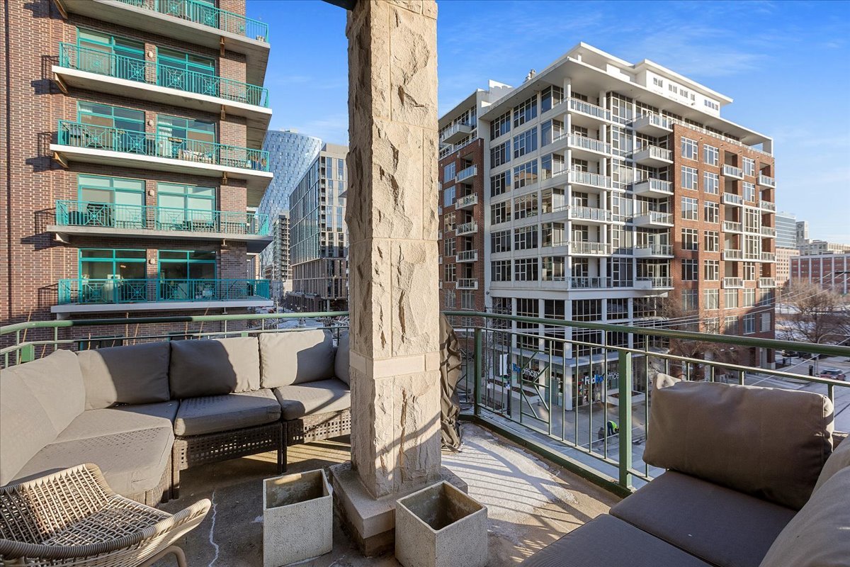 936 West Madison Street, Unit 4C Chicago, IL 60607 - Photo 13 of 16 a view of a balcony with couches and a potted plant