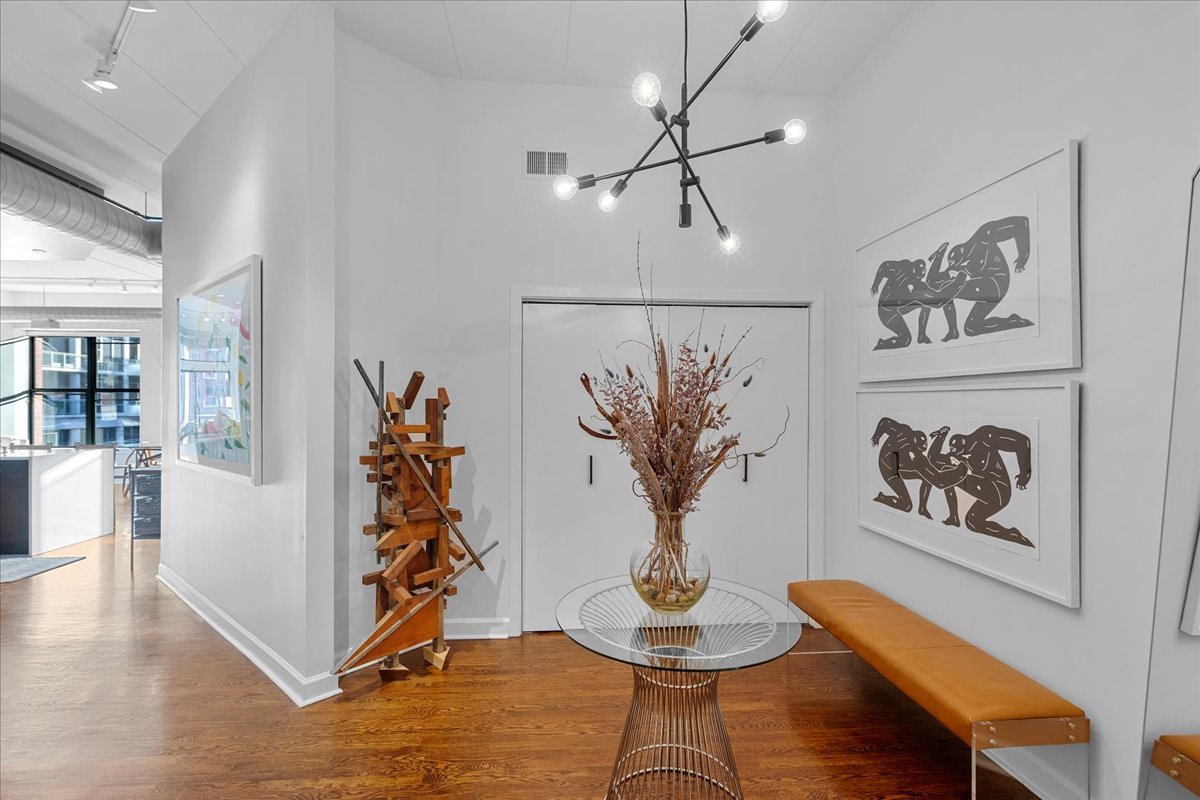 936 West Madison Street, Unit 4C Chicago, IL 60607 - Photo 14 of 16 a view of a dining room with furniture window and wooden floor