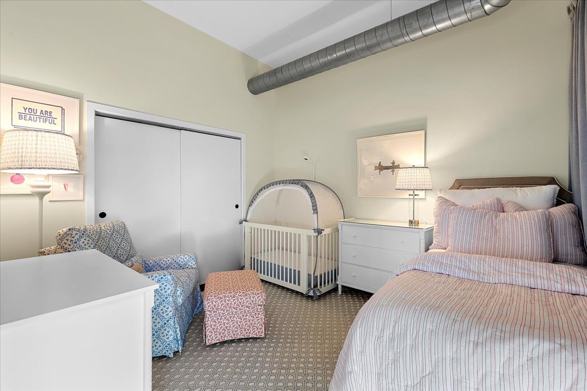 936 West Madison Street, Unit 4C Chicago, IL 60607 - Photo 10 of 16 a bedroom with a bed and a window