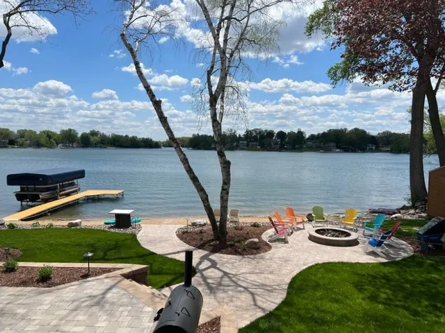 a view of a swimming pool with a table and chairs