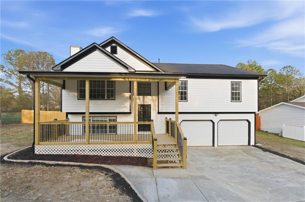3363 Old Oaks Road Buford, GA 30519 - Photo 1 of 29 a front view of a house with a yard