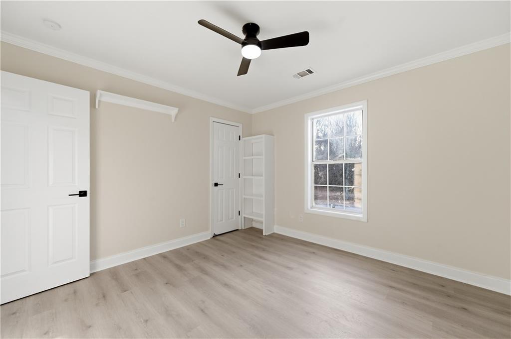 3363 Old Oaks Road Buford, GA 30519 - Photo 16 of 29 a view of an empty room with a window