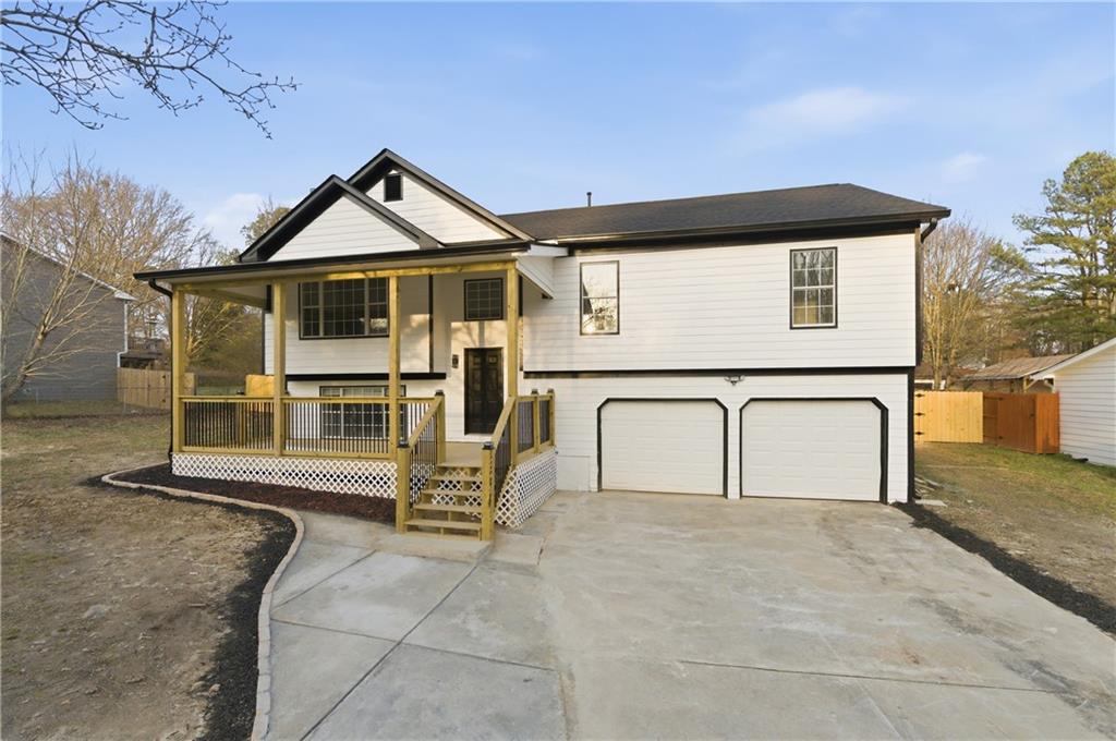 3363 Old Oaks Road Buford, GA 30519 - Photo 2 of 29 a view of residential house with wooden fence