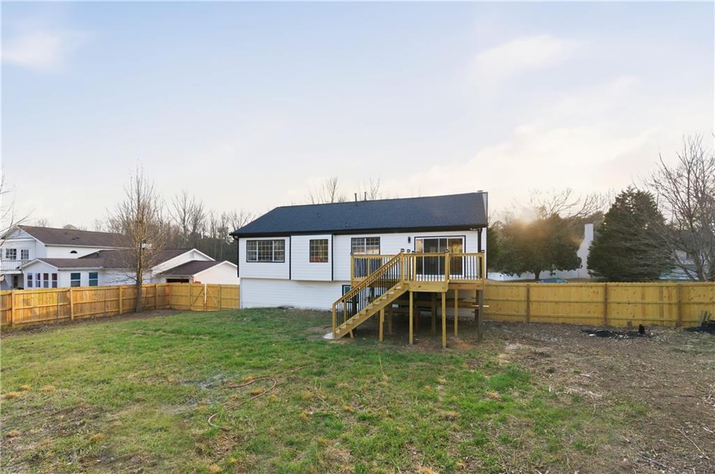 3363 Old Oaks Road Buford, GA 30519 - Photo 27 of 29 a view of a house with pool and a yard
