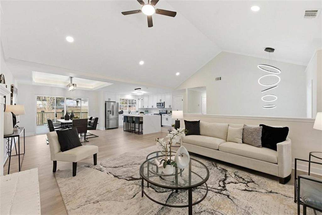 3363 Old Oaks Road Buford, GA 30519 - Photo 4 of 29 a living room with furniture kitchen view and a window