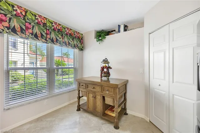 a workspace with furniture and window in a room