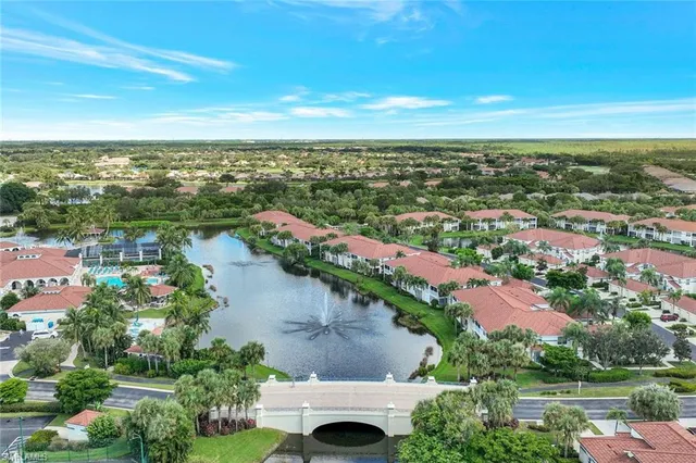 an aerial view of residential building and lake