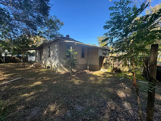 a fire hydrant in middle of the forest