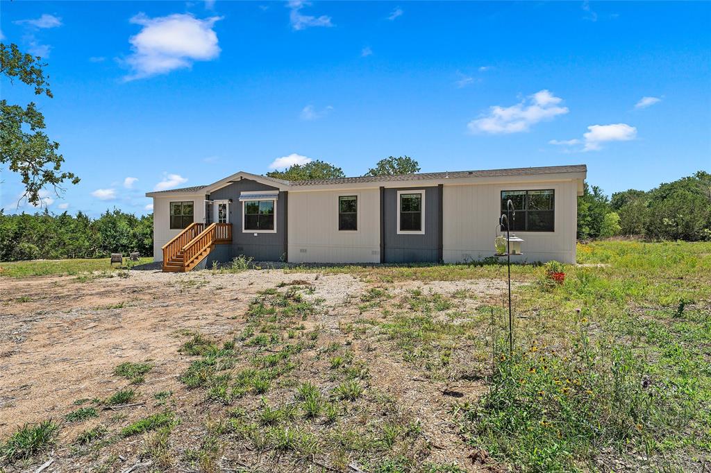 3050 Clater Powell Road Waco, TX 76705 - Photo 8 of 39 a view of a house with a backyard