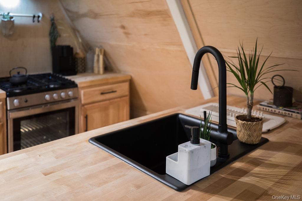 161 Pine Hill Road Shandaken, NY 12410 - Photo 13 of 39 Kitchen with stainless steel range with gas cooktop and light brown cabinetry