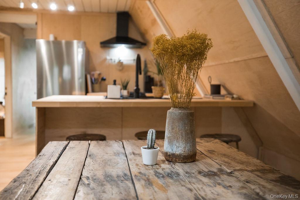 161 Pine Hill Road Shandaken, NY 12410 - Photo 15 of 39 Kitchen featuring freestanding refrigerator and wall chimney range hood