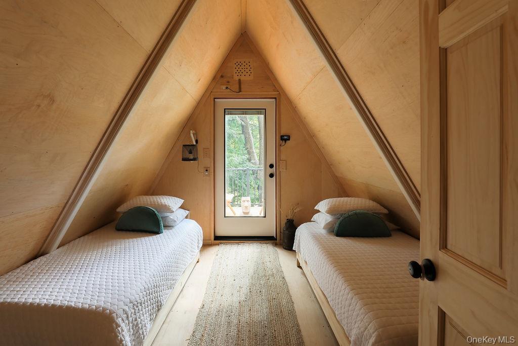 161 Pine Hill Road Shandaken, NY 12410 - Photo 26 of 39 Bedroom featuring vaulted ceiling and access to outside